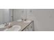 Well-lit bathroom offering dual sinks, ample counter space, and modern fixtures at 640 Avena Dr, Elizabeth, CO 80107