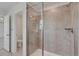 Bathroom featuring a glass enclosed shower with tiled surround and chrome fixtures at 640 Avena Dr, Elizabeth, CO 80107