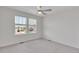 Bedroom with neutral carpet and large windows providing ample natural light at 640 Avena Dr, Elizabeth, CO 80107
