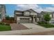 Beautiful two-story home with a stone-accented facade and an attached garage at 640 Avena Dr, Elizabeth, CO 80107