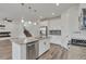 Bright kitchen features stainless appliances, a center island, and views to the living room at 640 Avena Dr, Elizabeth, CO 80107
