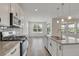 Modern kitchen with granite countertops, stainless steel appliances, and an open layout at 640 Avena Dr, Elizabeth, CO 80107