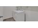 Convenient laundry room features a modern washer and dryer with handy shelving above at 640 Avena Dr, Elizabeth, CO 80107