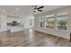 Bright living room offering an open floorplan and scenic views from the large windows at 640 Avena Dr, Elizabeth, CO 80107