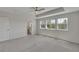 Bright main bedroom with tray ceiling, fan and multiple windows for natural light at 640 Avena Dr, Elizabeth, CO 80107