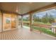 Covered patio featuring wood flooring and beautiful views of the landscaped backyard at 640 Avena Dr, Elizabeth, CO 80107