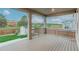 Covered wood patio overlooking the fenced yard and neighborhood at 640 Avena Dr, Elizabeth, CO 80107