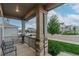 Inviting front porch with stone pillars and a cozy bench for relaxing at 640 Avena Dr, Elizabeth, CO 80107