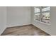 Clean, bright room with wood floors, large window, and neutral paint at 640 Avena Dr, Elizabeth, CO 80107