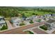 Scenic view of a neighborhood showcasing well-kept homes, manicured lawns, and lush greenery with trees in the background at 640 Avena Dr, Elizabeth, CO 80107
