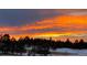 Scenic landscape featuring a fiery sunset sky casting a warm glow over trees and landscape at 640 Avena Dr, Elizabeth, CO 80107