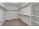 Walk-in closet with built-in shelving providing ample storage space at 640 Avena Dr, Elizabeth, CO 80107