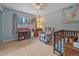 Bedroom with blue walls, a window view, and a crib with soft colors at 7585 Native Dancer Trl, Evergreen, CO 80439