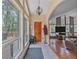 Inviting entryway featuring large windows, tile flooring, and a seamless transition to the living area at 7585 Native Dancer Trl, Evergreen, CO 80439