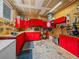 Well-organized garage featuring ample red cabinet storage and a workbench at 7585 Native Dancer Trl, Evergreen, CO 80439
