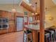 Well-appointed kitchen with granite countertops, stainless appliances, and an inviting breakfast bar area at 7585 Native Dancer Trl, Evergreen, CO 80439
