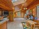 Playroom with lots of storage, wood ceiling, skylight, whiteboard, and a colorful rug at 7585 Native Dancer Trl, Evergreen, CO 80439