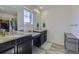 Bathroom featuring dual sinks, granite counters, and modern fixtures at 10992 Xanadu St, Commerce City, CO 80022