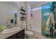 Well-lit bathroom with shower/tub, decorative shelves, and modern fixtures at 10992 Xanadu St, Commerce City, CO 80022