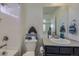 Charming bathroom with playful decor, shower-tub combo, and functional design at 10992 Xanadu St, Commerce City, CO 80022