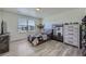 Inviting bedroom featuring a window with neighborhood views and a playful hammock at 10992 Xanadu St, Commerce City, CO 80022