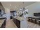 Spacious kitchen with granite countertops, large island, and adjacent dining area at 10992 Xanadu St, Commerce City, CO 80022