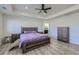 Spacious bedroom with wood flooring, a ceiling fan, and ample natural light at 10992 Xanadu St, Commerce City, CO 80022