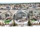 An elevated aerial view highlights the backyard of this home with its elevated deck and neighborhood at 762 Tailings Dr, Monument, CO 80132