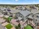 Aerial view showcasing the backyard, community, landscaping, and modern homes at 762 Tailings Dr, Monument, CO 80132