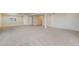 Expansive carpeted basement featuring neutral walls and ample natural light from the window at 762 Tailings Dr, Monument, CO 80132