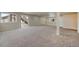 Large basement with sliding glass doors and a finished carpet, and access to an outdoor stairway at 762 Tailings Dr, Monument, CO 80132