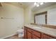 Bathroom with granite countertops, wood cabinets, and tile flooring, providing a comfortable space at 762 Tailings Dr, Monument, CO 80132