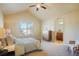 Bright bedroom with a window view and ensuite bathroom at 762 Tailings Dr, Monument, CO 80132