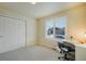 Bright bedroom with carpet, a window with shutters, a closet, and a desk at 762 Tailings Dr, Monument, CO 80132