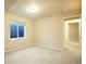 Bright bedroom with carpeted floors, neutral paint, and natural light from a window at 762 Tailings Dr, Monument, CO 80132