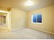 Bedroom featuring neutral walls, carpeted flooring, a closet and a window that provide natural light at 762 Tailings Dr, Monument, CO 80132