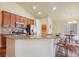 Stylish kitchen featuring granite countertops, stainless steel appliances, and adjacent dining area at 762 Tailings Dr, Monument, CO 80132