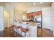 Kitchen with stainless steel appliances and an island with seating at 762 Tailings Dr, Monument, CO 80132