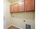 A utility room with neutral walls, cabinets, and tile flooring at 762 Tailings Dr, Monument, CO 80132