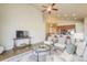 An airy living room featuring an open layout, vaulted ceilings, and modern decor with hard wood flooring at 762 Tailings Dr, Monument, CO 80132