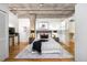 Comfortable bedroom with a plush rug, concrete ceiling, and a walk-in closet for ample storage at 1801 Wynkoop St # 411, Denver, CO 80202