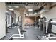 Well-equipped gym area with various exercise machines and rubber flooring at 1801 Wynkoop St # 411, Denver, CO 80202