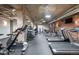 Well-equipped gym area with various exercise machines and rubber flooring at 1801 Wynkoop St # 411, Denver, CO 80202