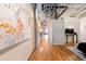 Hallway featuring hardwood floors and artistic details leading to a spacious bedroom at 1801 Wynkoop St # 411, Denver, CO 80202