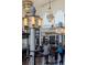 Grand terminal interior with ornate chandeliers, high ceilings, and a bustling cafe scene at 1801 Wynkoop St # 411, Denver, CO 80202