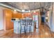 Modern kitchen with wood cabinets, stainless steel appliances and industrial ceiling at 1801 Wynkoop St # 411, Denver, CO 80202