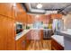 Modern kitchen featuring stainless steel appliances, wooden cabinets, marble countertops, and stylish backsplash at 1801 Wynkoop St # 411, Denver, CO 80202
