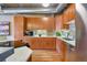 Modern kitchen featuring stainless steel appliances, wooden cabinets, marble countertops, and stylish backsplash at 1801 Wynkoop St # 411, Denver, CO 80202