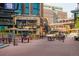 Vibrant outdoor plaza with restaurants and colorful seating, creating an inviting atmosphere at 1801 Wynkoop St # 411, Denver, CO 80202