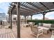 Inviting rooftop deck with comfortable seating, pergola, and a cityscape backdrop at 1801 Wynkoop St # 411, Denver, CO 80202